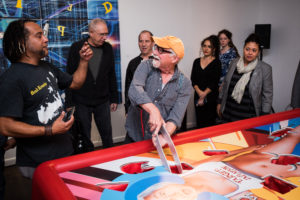 Jason "Forge" Rodriguez coaching a player at Premiere of Corporation by Corp Cru at Georges Bergès Gallery in New York, NY. Photos by Mark Kauzlarich