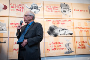 Gene Epsein, Economic Editor of Barrons giving a speech about the Federal Reserve at the premiere of Corporation by Corp Cru at Georges Bergès Gallery in New York, NY. Photos by Mark Kauzlarich